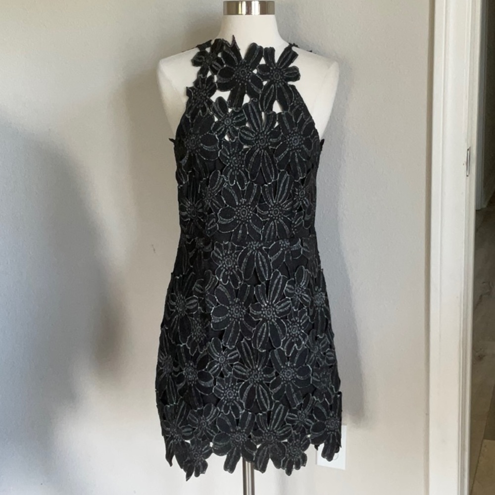 Free People saylor dress size small . New with tags . Black floral . Beautiful!